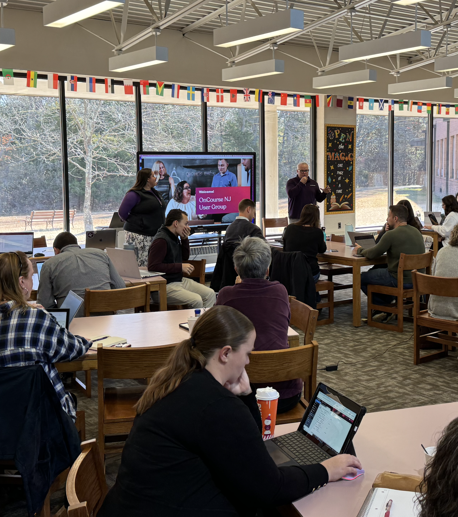 Photo of an OnCourse SIS NJ User Group with a presenter and NJ school district attendees